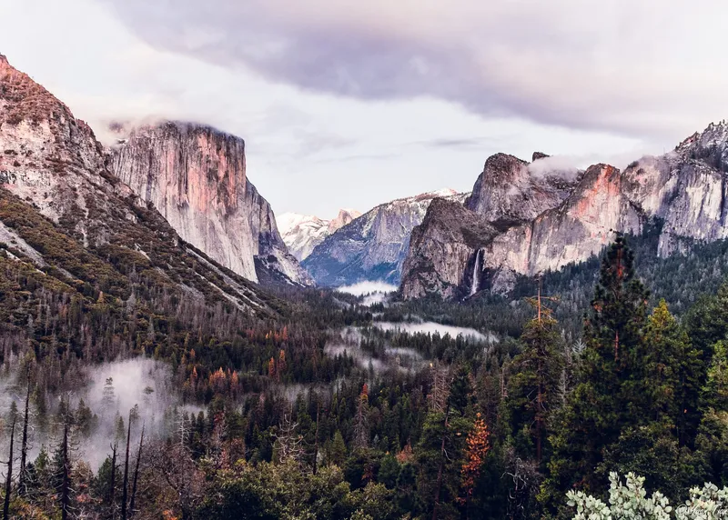 Yosemite Valley from Tunnel View: El Capitan, Half Dome, and Bridalveil Fall above a fog-filled valley floor